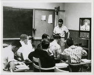 Camera films students watching television in class