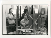Students painting with their easels in an art class
