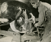 Man performing a front end alignment