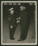 Henry Nickel being presented with the Bronze Star by Capt. A.C. Olney