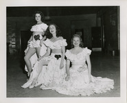 Women posing in festive costumes