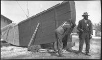 Two men with wood at Walker Ship Yard