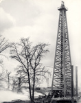 Oil derrick with trees