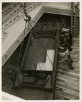 Vehicle being loaded below deck on ship