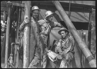 Group of men at an oil well in Brazoria County