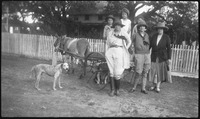 Group in front of a mule-drawn cart