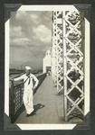 Navy sailor on a bridge