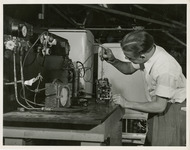 Man working on a device with a screwdriver 