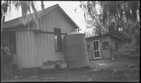 Small house with tank and shack