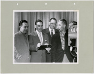 Roy Barthold, Paul Owen, Dean Johnson, and George Arms talk behind the camera