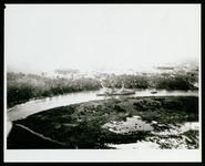 USS Houston (CA-30) passing through rural area of Houston Ship Channel, taken from the air