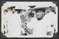 A man holding a tool for scourging