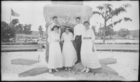 Group of people in front of a concrete structure