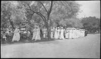 Line of young women in white