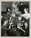 KUHT staff members decorate a Christmas tree