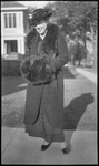 Woman with fur scarf and muff