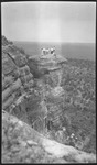 Group of people standing on mountain ledge