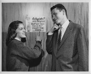 Judy Moriss and Ron Mendenhall promoting coat and tie week
