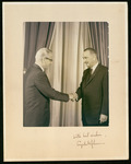President Philip G. Hoffman shaking hands with Lyndon B. Johnson