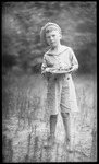 Boy holding plate of food