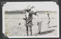 A boy looking on as a flagellant is scourged