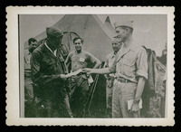 Men in front of tent, evacuation of POWs