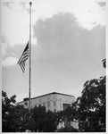 American flag at half-staff near the Ezekiel Cullen Building (close-up)