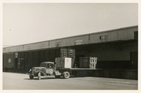 Truck parked next to warehouse