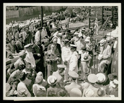 Mayor of Houston, Texas, Otis Massey, at the microphone at the USS Houston (CL-81) launching ceremony