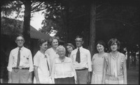 Group of people in front of house