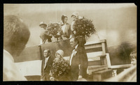 Mary Ellen Bute (maid of honor), Elisabeth Holcombe (ship's sponsor), and Charlotte Williams (special guest) on platform at USS Houston (CA-30) launching ceremony