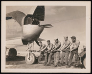 Marines connect PBJ-1H to a tractor