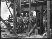 Group of men at an oil well in Brazoria County