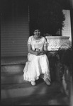 Smiling woman sitting on steps
